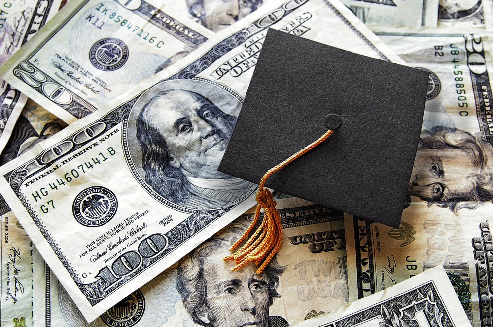 Student Loans - Money with a Graduation hat on top